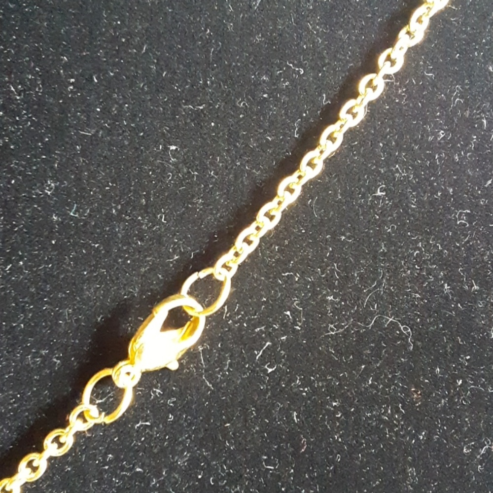 Golden bow necklace. - Picture 3 of 3